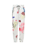 FROLICSOME: Ivory jogger pant in floral printed tech satin